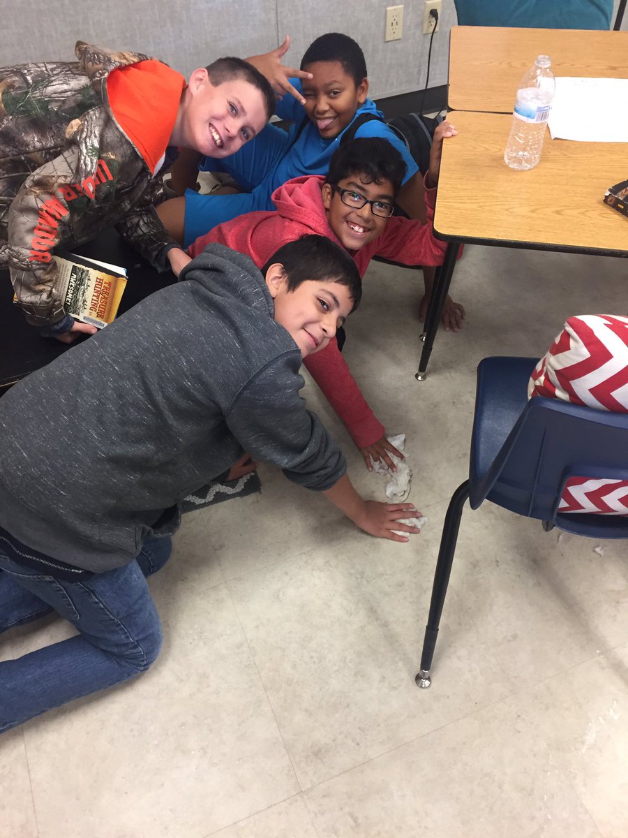 Here's a picture of some of my 2nd period guys attempting to clean up a water bottle spill with toilet paper. 🙃 Never a dull moment!