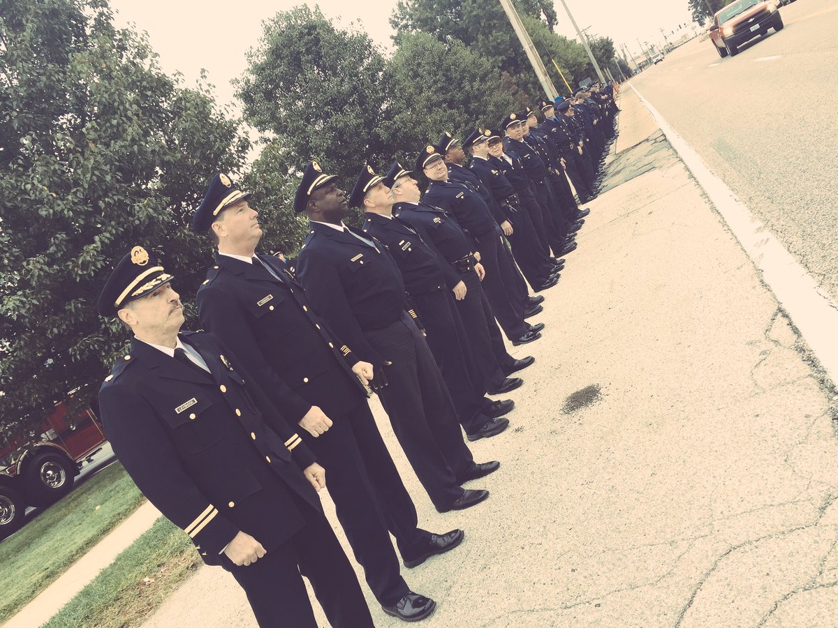 SLMPD's tweet photo. SLMPD officers pay their respects alongside other agencies as @stlcountypd prepares to lay Officer Blake Snyder to rest. #WeStandTogether https://t.co/S1mbXcOKwz