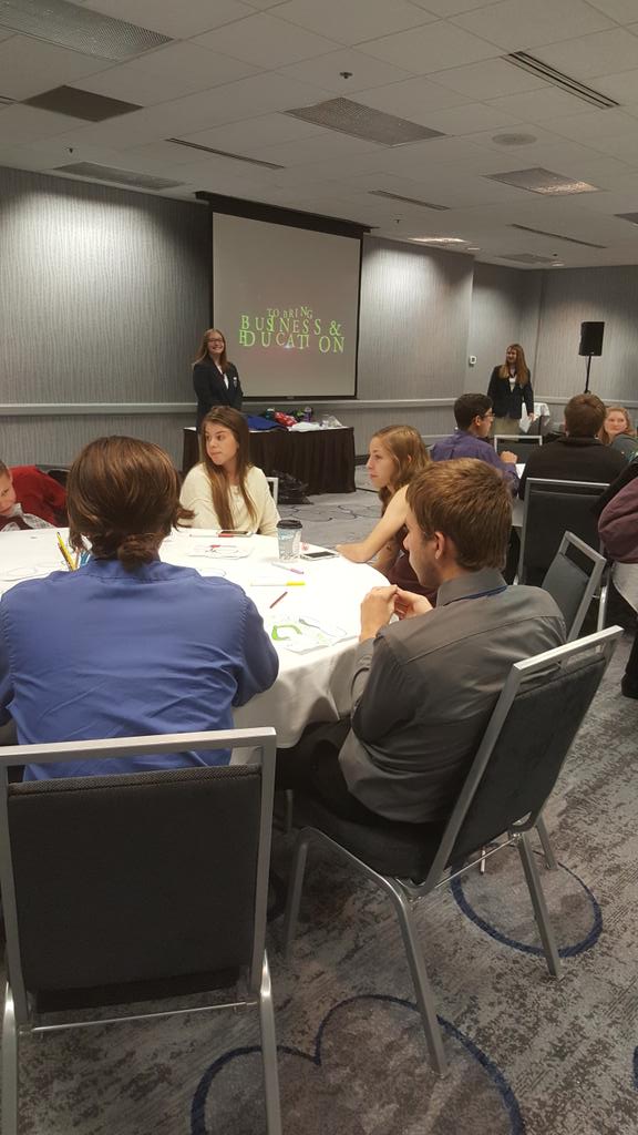 DeForestFBLA's tweet photo. @fblawireg5vp17 and @fblawipres17 presenting a workshop at #WIFBLAFLL while DeForest members @HunterCrawfor19 and Niko look on. https://t.co/H5ta0zSMcl