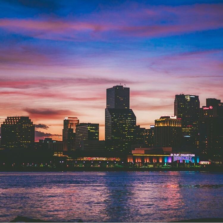 New Orleans is draped in a blanket of color as night falls on the city. Photo: @kewonhunter9 #followyournola