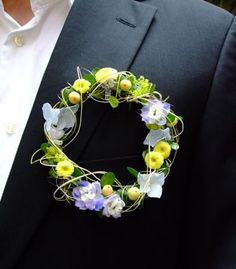 Meet the mini-wreath, giving the traditional buttonhole a run for its money. Dainty, intricate &amp; just a little bit different!#weddingflowers
