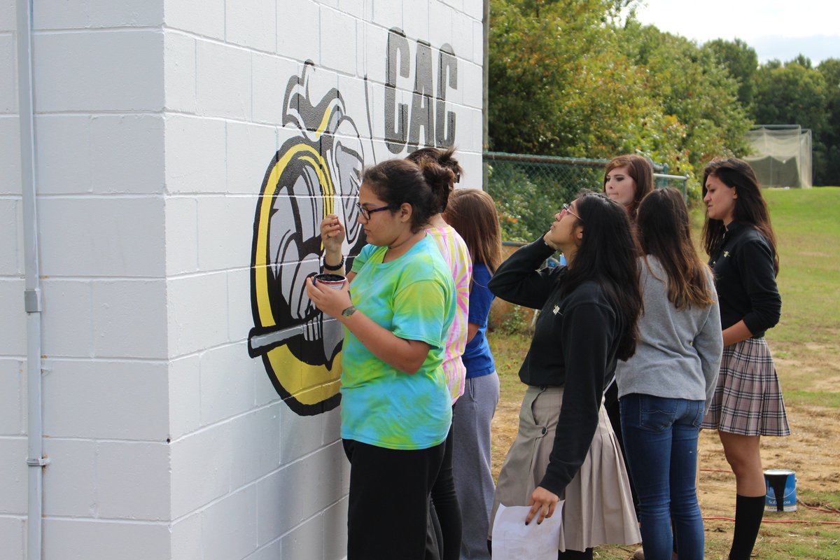 SJVHS Art Club paints Catholic Athletes for Christ (CAC) logo near turf field. <a href="/CatholicAthlete/">C A C</a> <a href="/SJVSA/">SJV Activities</a> #sjvlancers #sjvartistsofthefuture