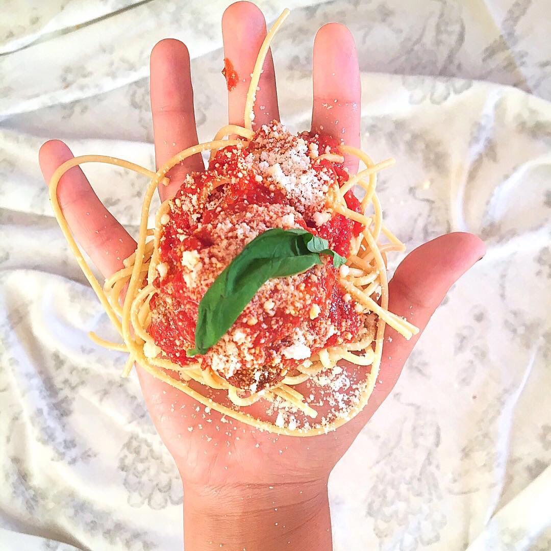WhatImHolding's tweet photo. Gab @brbcookingdinner, chef &amp; carb enthusiast, holds spaghetti w/ meatball, Pecorino Romano cheese, basil, &amp; sauce https://t.co/adJvspWdT4