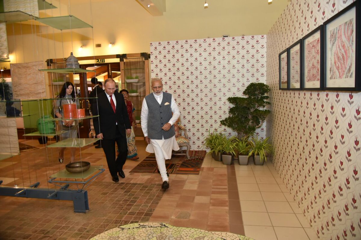 MEAIndia's tweet photo. A quiet tete-a-tete before beginning restricted talks. PM @narendramodi and President Putin @KremlinRussia_E meet in the Leaders Lounge https://t.co/9uyh76u39M