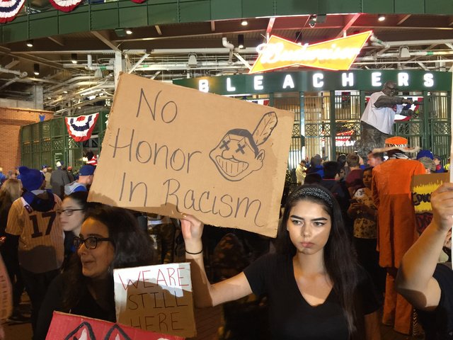 darrenrovell's tweet photo. Members of the Ho-Chunk &amp; Potawatomi  tribe of Illinois protesting Chief Wahoo logo outside Wrigley https://t.co/n6byRmk5cO