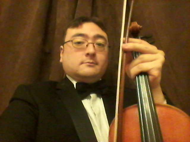 JagexAsh's tweet photo. It's not the Halloween weekend costume I'd have chosen, but I'd agreed to play in a concert. Mostly Handel. gf Handel. https://t.co/QhQl6mT6Ta