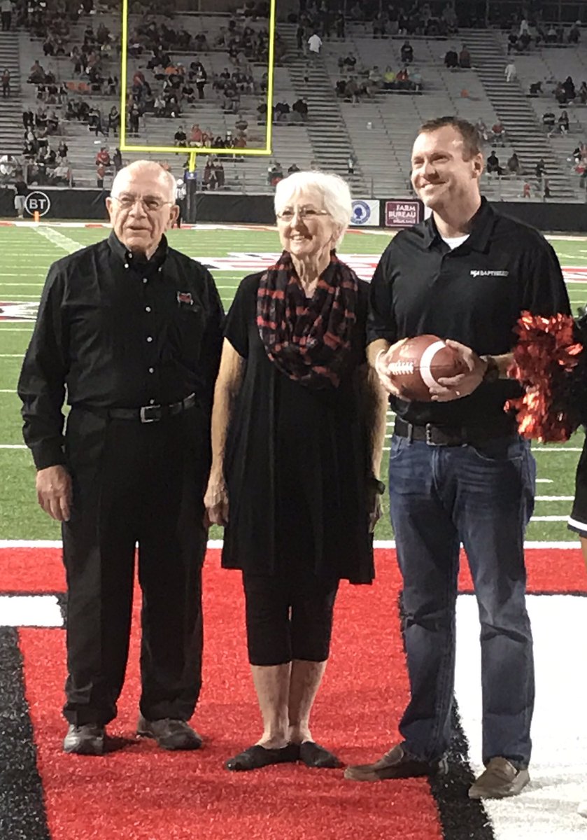 NEABaptGiving's tweet photo. Honoring @NEABaptist Hometown Heroes Jake and June Morse at tonight's @RedWolvesFBall game for their support. https://t.co/57BKc6TJjk