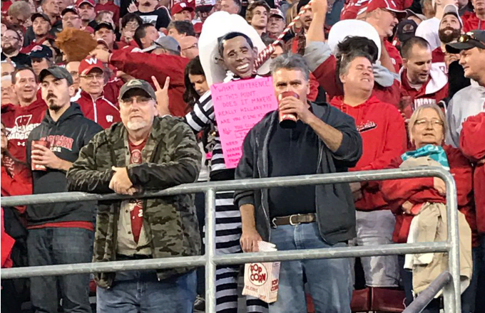 Complex's tweet photo. Awful fan wears Obama mask and noose around neck at Wisconsin football game. https://t.co/2V44ewAGtu https://t.co/QjeNsEyAQO