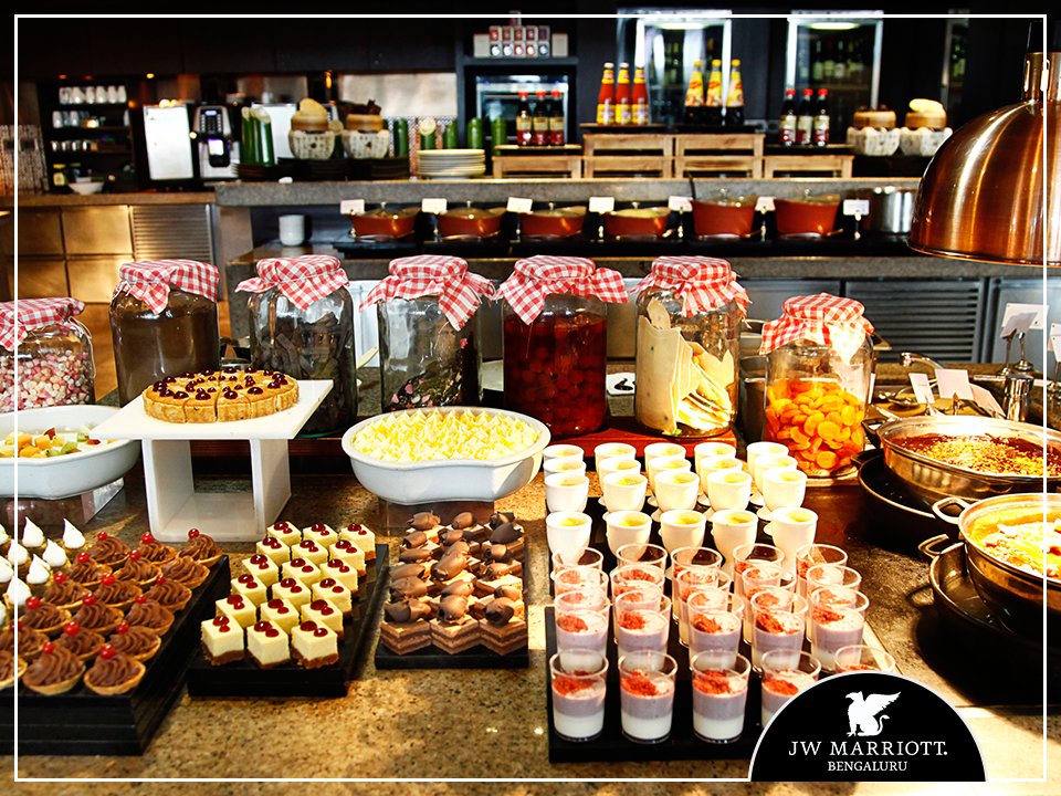JWMarriottBLR's tweet photo. Spend your #LaidBackSaturdays immersed in our drool-worthy dessert counter at #JWKitchen. Click here: https://t.co/Q2GdJeKepJ https://t.co/VmHxf4YP2m