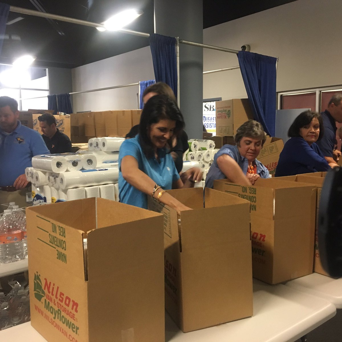 PriscillaWT's tweet photo. Governor Nikki Haley just arrived in Marion County! She's helping box up water and cleaning supplies for storm victims. #hurricaneMathew https://t.co/mhHAvRNAUr