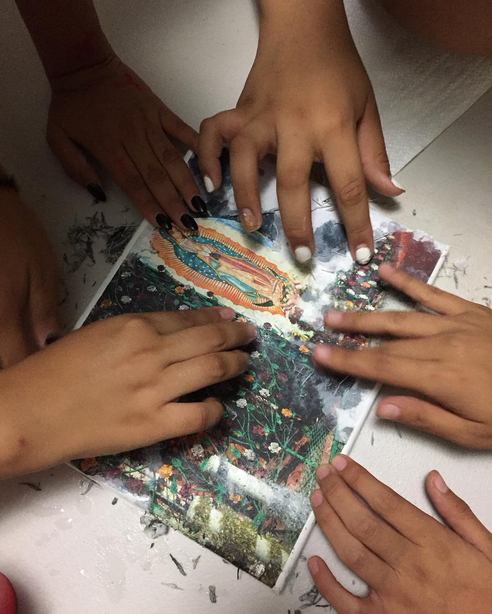 lasfotosproject's tweet photo. LFP students working on a photo transfer for our #DiaDeLosMuertos art show. Students wrote sensory poems and altered photos. #communityaltar https://t.co/FzKKvOeHRJ