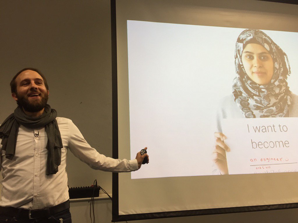 geoffstead's tweet photo. Florian Rücker talking about how Kiron prepares refugee young adults for university access #TFCam https://t.co/hO3ywwd1em