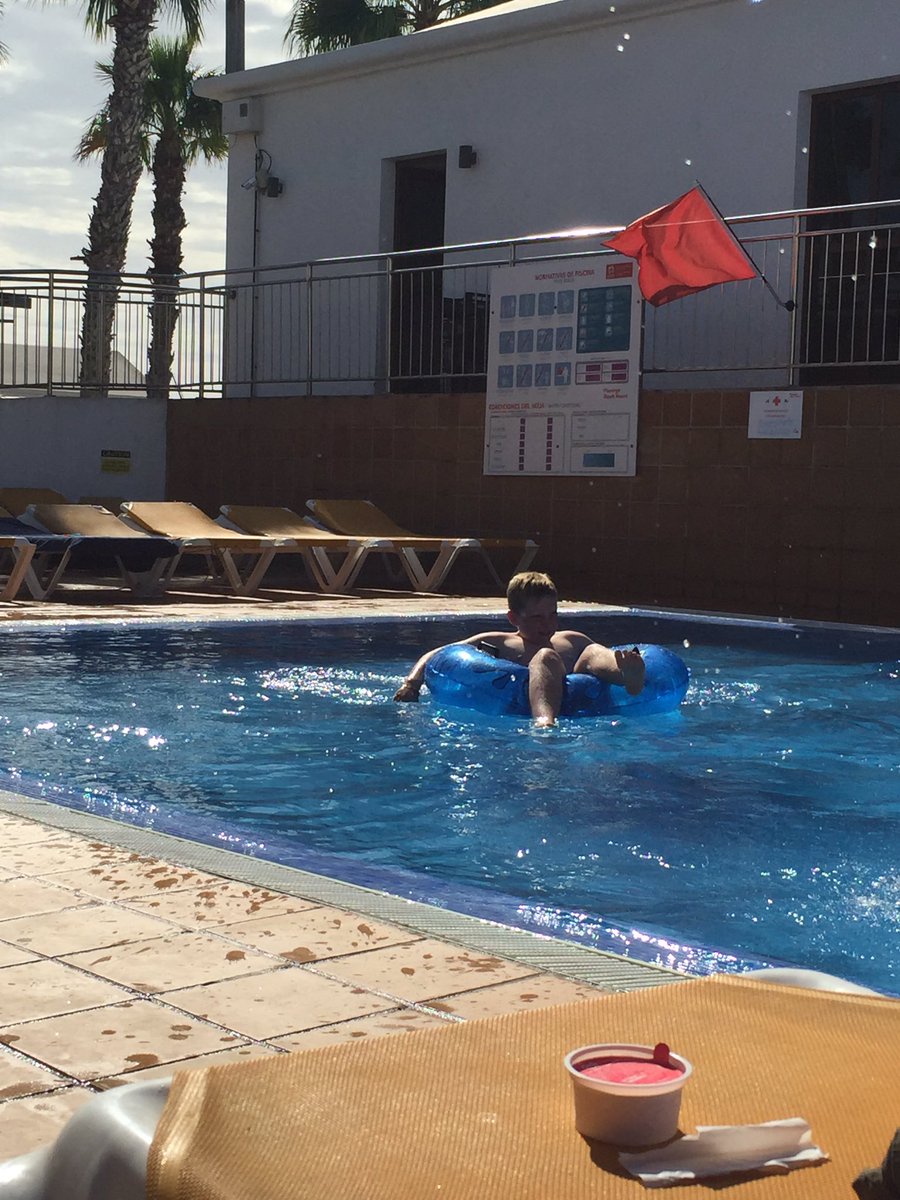 sam886's tweet photo. One happy holiday boy. #swimmingpool #waterring #icecreamwaiting #flamingobeach #lanzarote https://t.co/z1EUSXxV2n