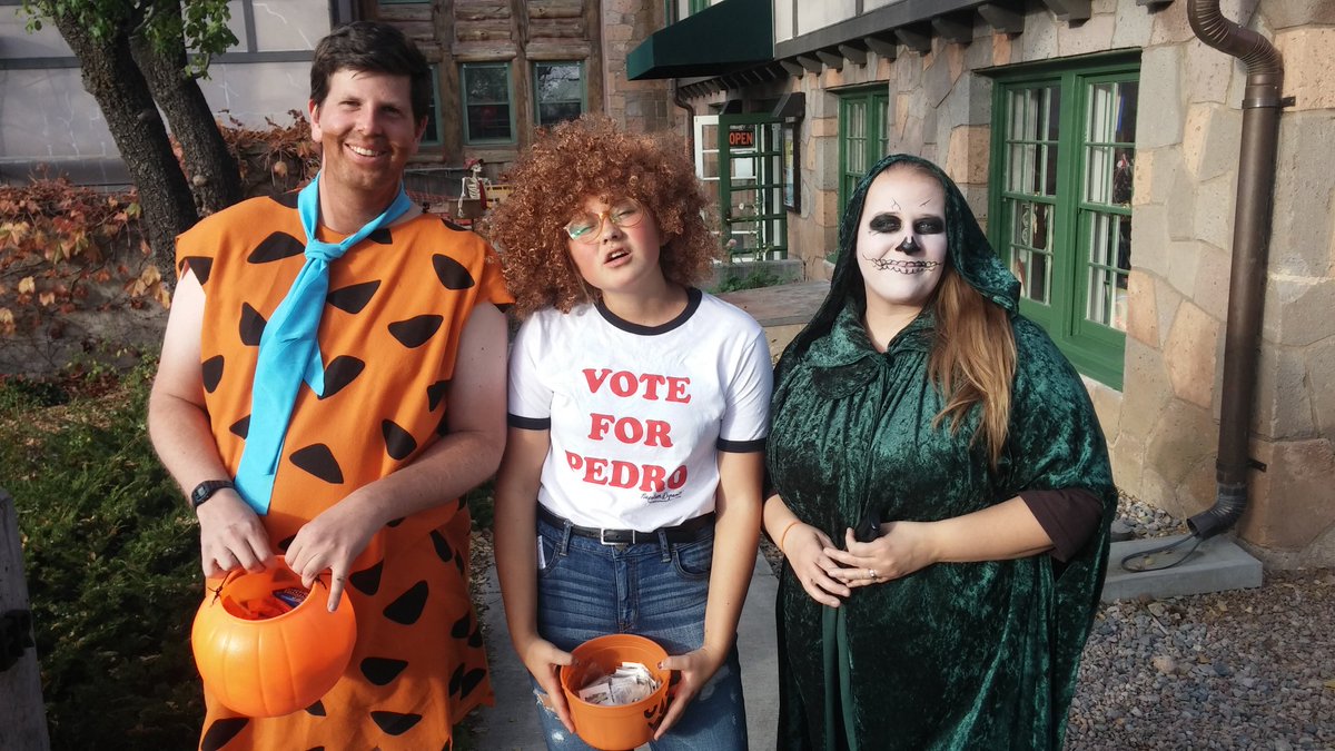 AmyBjarke's tweet photo. A rather odd combination of #FredFlintsone #napoleondynamite and whatever I am...
#trickortreat on Main Street https://t.co/N5CKh5g22O