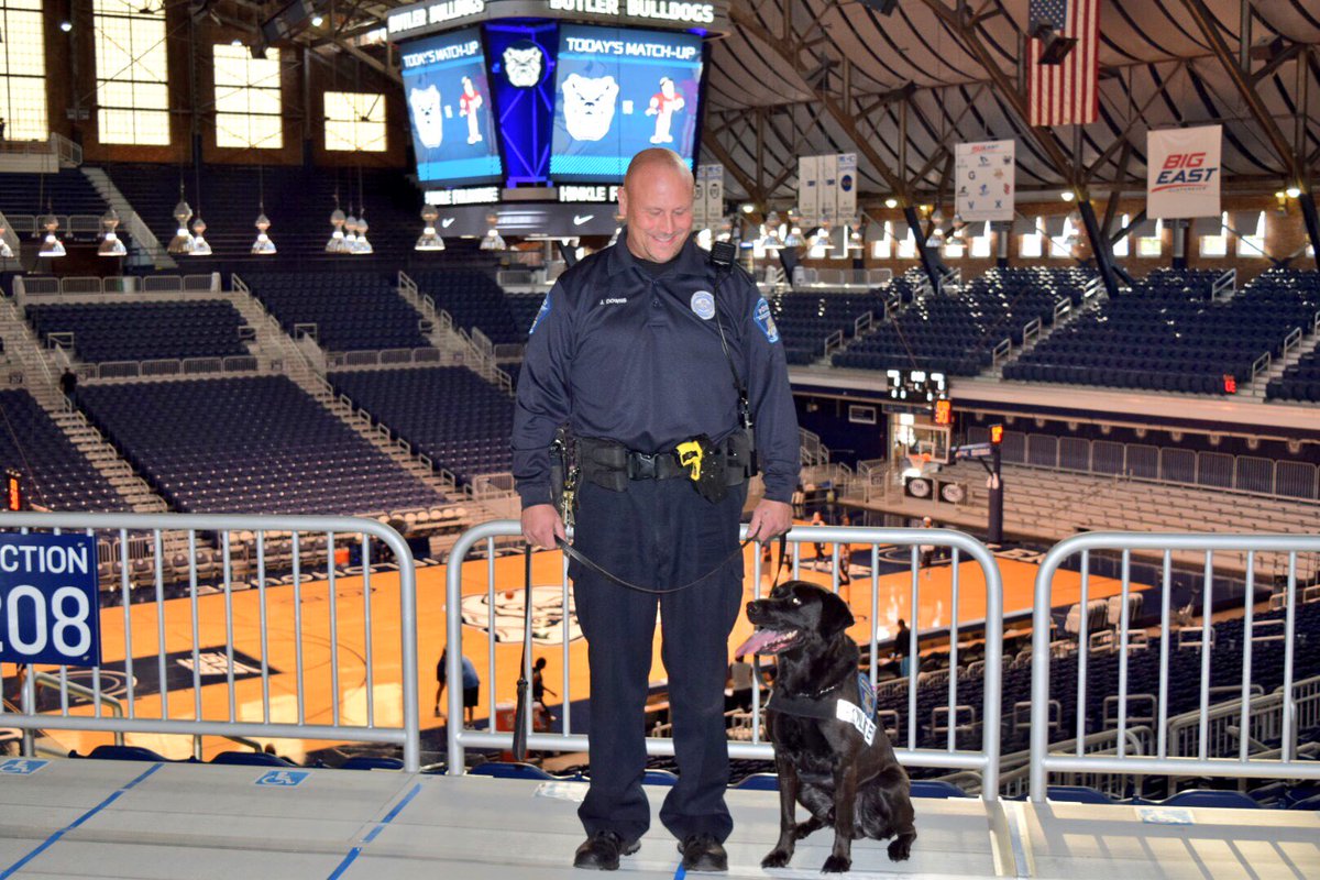 ButlerUpolice's tweet photo. EOD K9 Marcus and Officer Jason Downs have swept #Hinkle. It's almost @ButlerMBB game time. #BUsafe #SeeSomethingSaySomething https://t.co/Kg1cLvxI3J