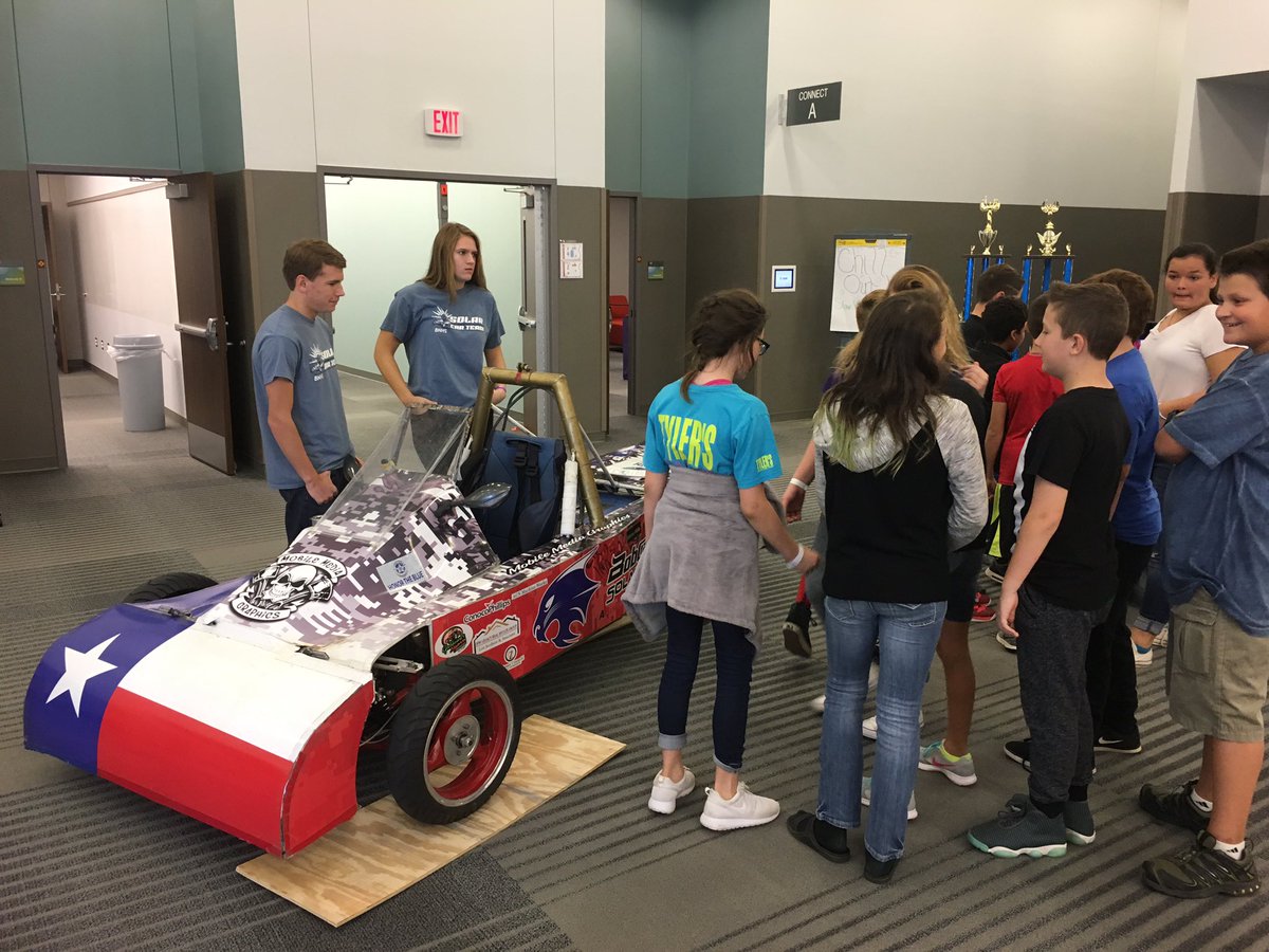 Taylor_CTE's tweet photo. @heather_ericks and @rtswimgym99 explaining to kids how the @Bnhs_solarcar works. @ByronNelsonHigh @NisdCTE @NorthwestISD #ESC11STEAM https://t.co/hffehOITWQ