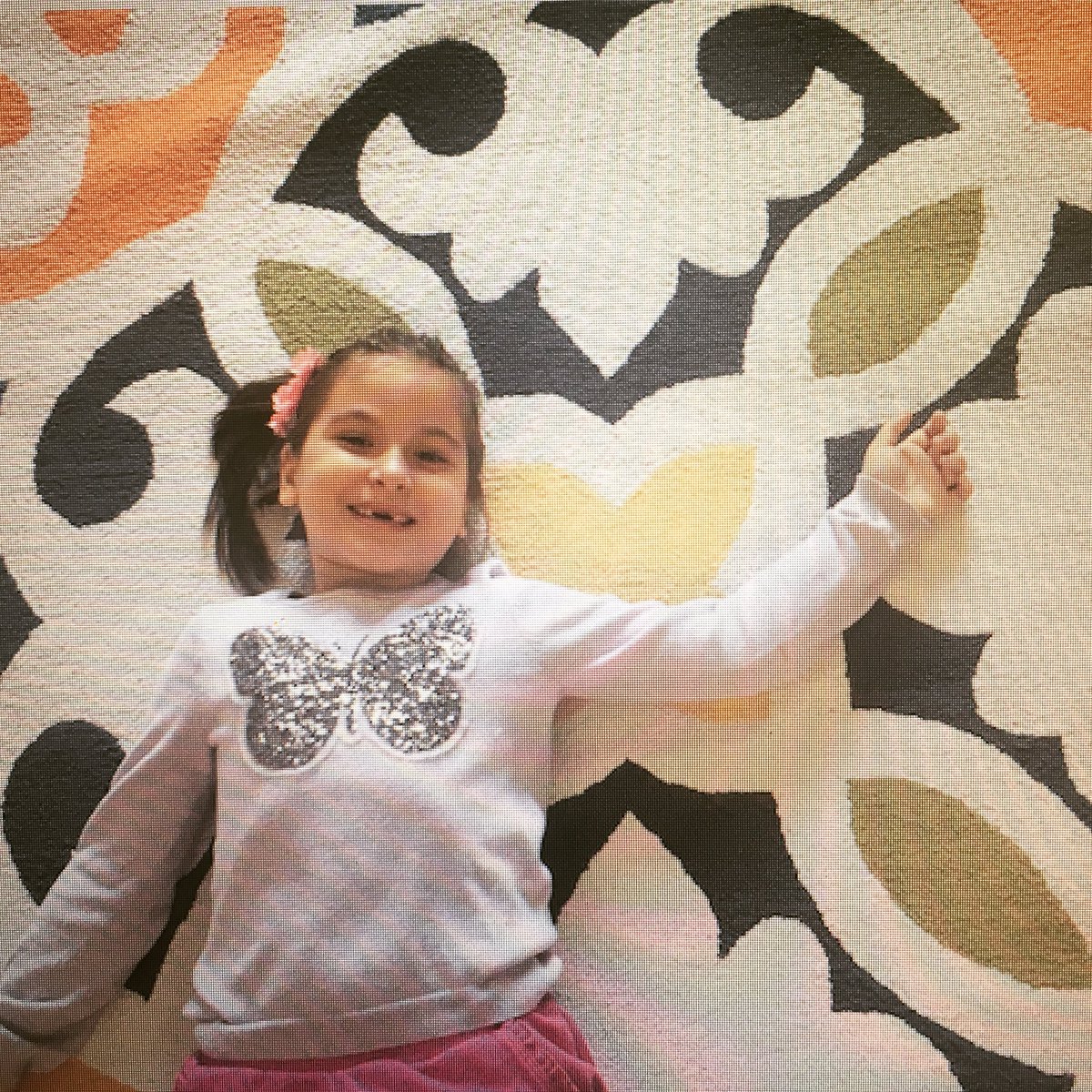 Our kid model posing for the new rug collection in stock now! #kidmodel #rugs #bright #colorful #cotton #tufted #rug #galaxycarpet #smile