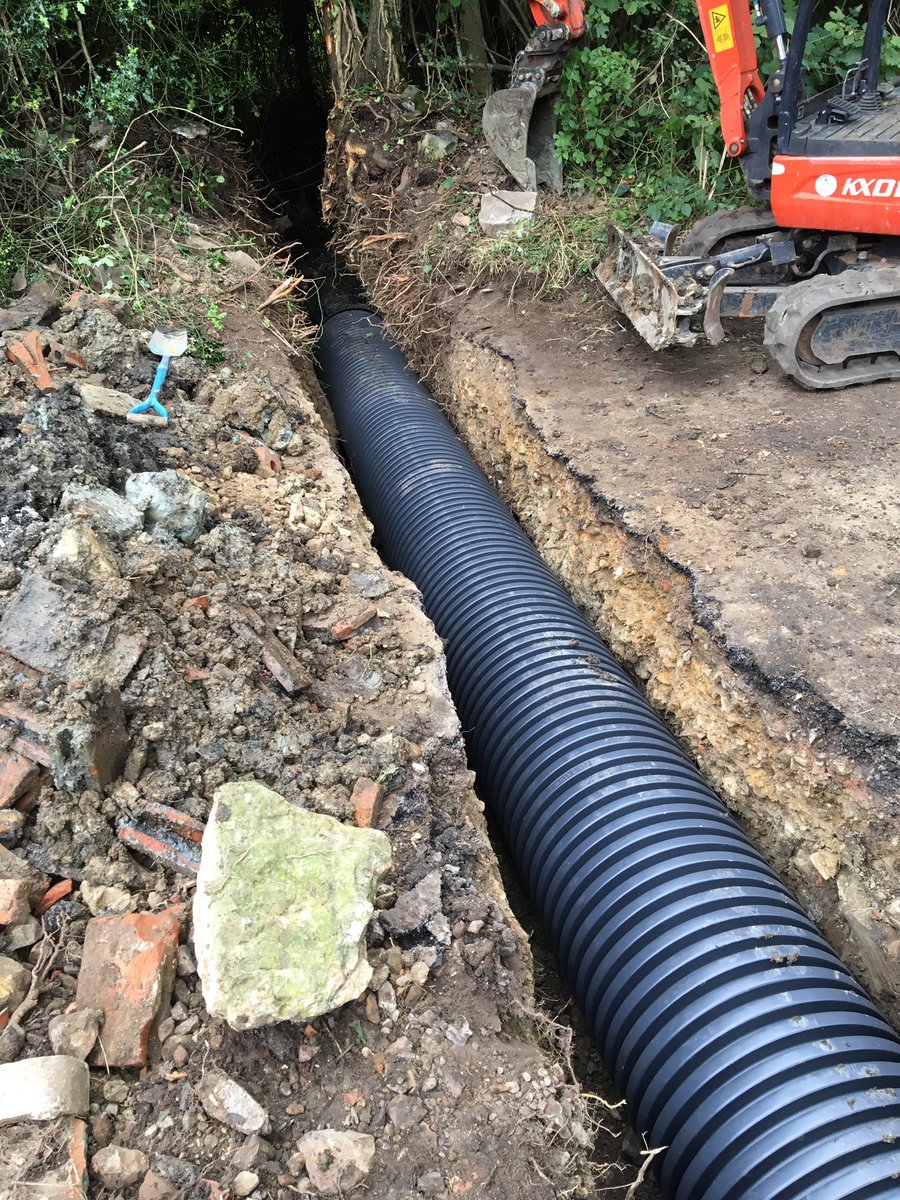 BelowGroundDW's tweet image. Flood relief pipe work installed in Chard Somerset across the road and concreted in place before remaking the road
