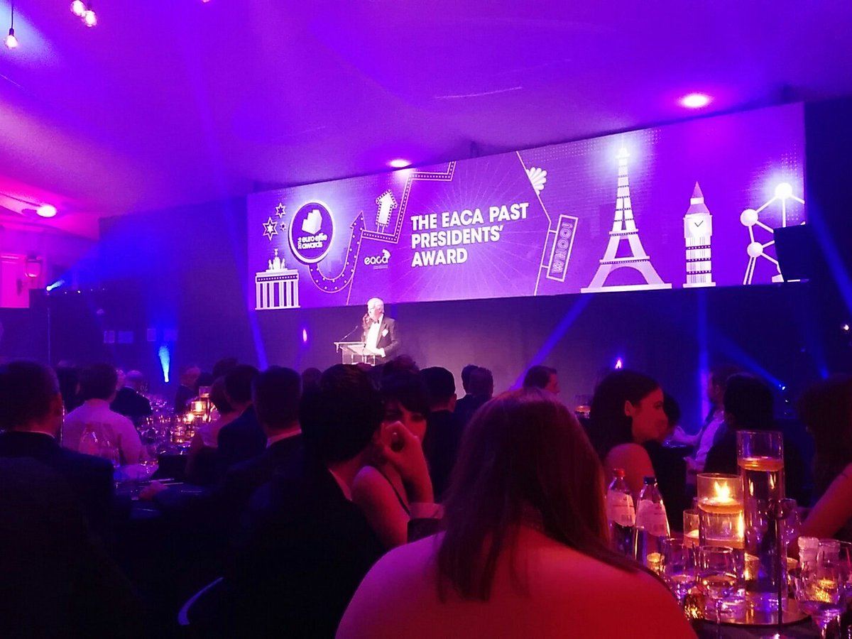 mtzaerli's tweet photo. Celebrating 20 years of the #euroeffies20th! Dom Lyle on stage -audience applauds for his fantastic work over the years! @EACA_eu #flashback https://t.co/Rv8tw9XjWm