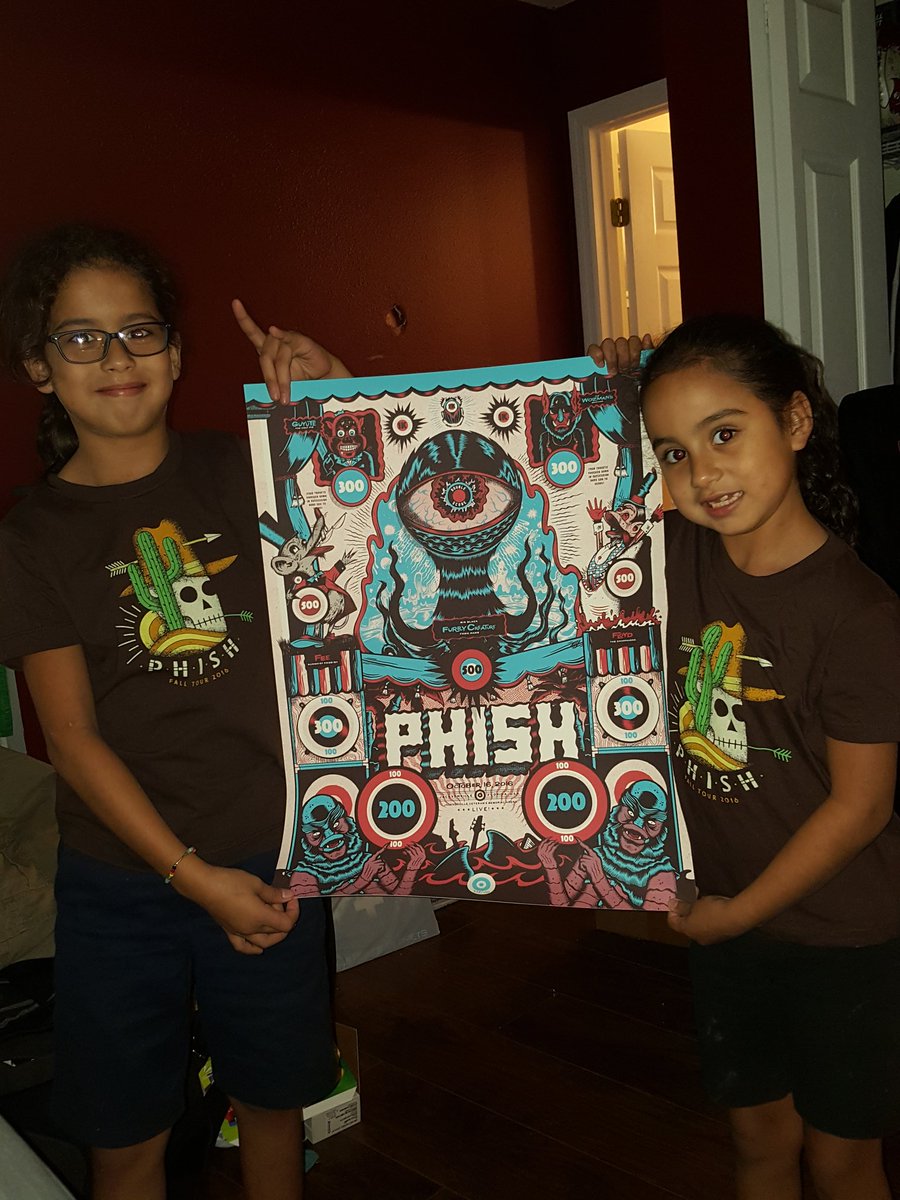 maj0678's tweet photo. 2 of my 4 daughters wearing their #phishfall shirts I got at the jax show n my poster #PHISH https://t.co/ZI5xTATbug