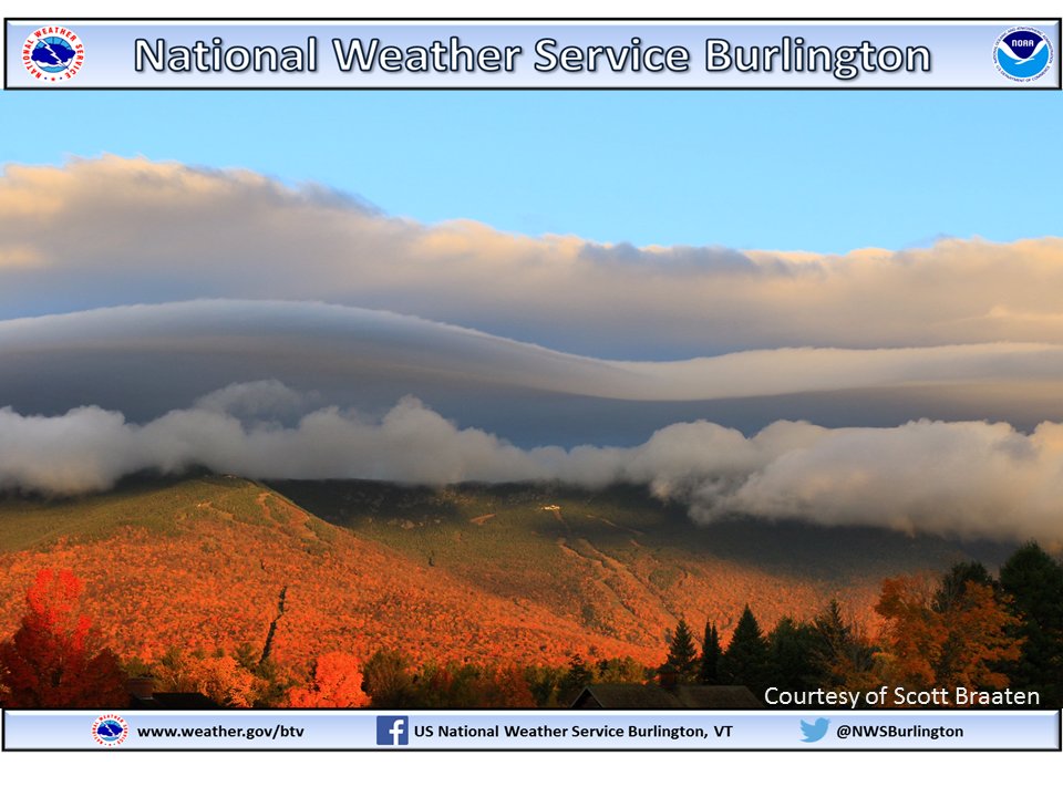 NWSBurlington's tweet photo. Great shot (courtesy of Scott Braaten) of Mt Mansfield with cap clouds over top, contrasted against the remaining sun-kissed fall foliage. https://t.co/lnlPKZg97N