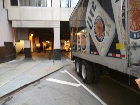 Outtathelane's tweet photo. @ChiBevSystems TTWW)O large semis today in the bike lane on Grand at the most dangerous part under the bridge! @activetrans @thechainlinkorg https://t.co/BKJaCekXvO