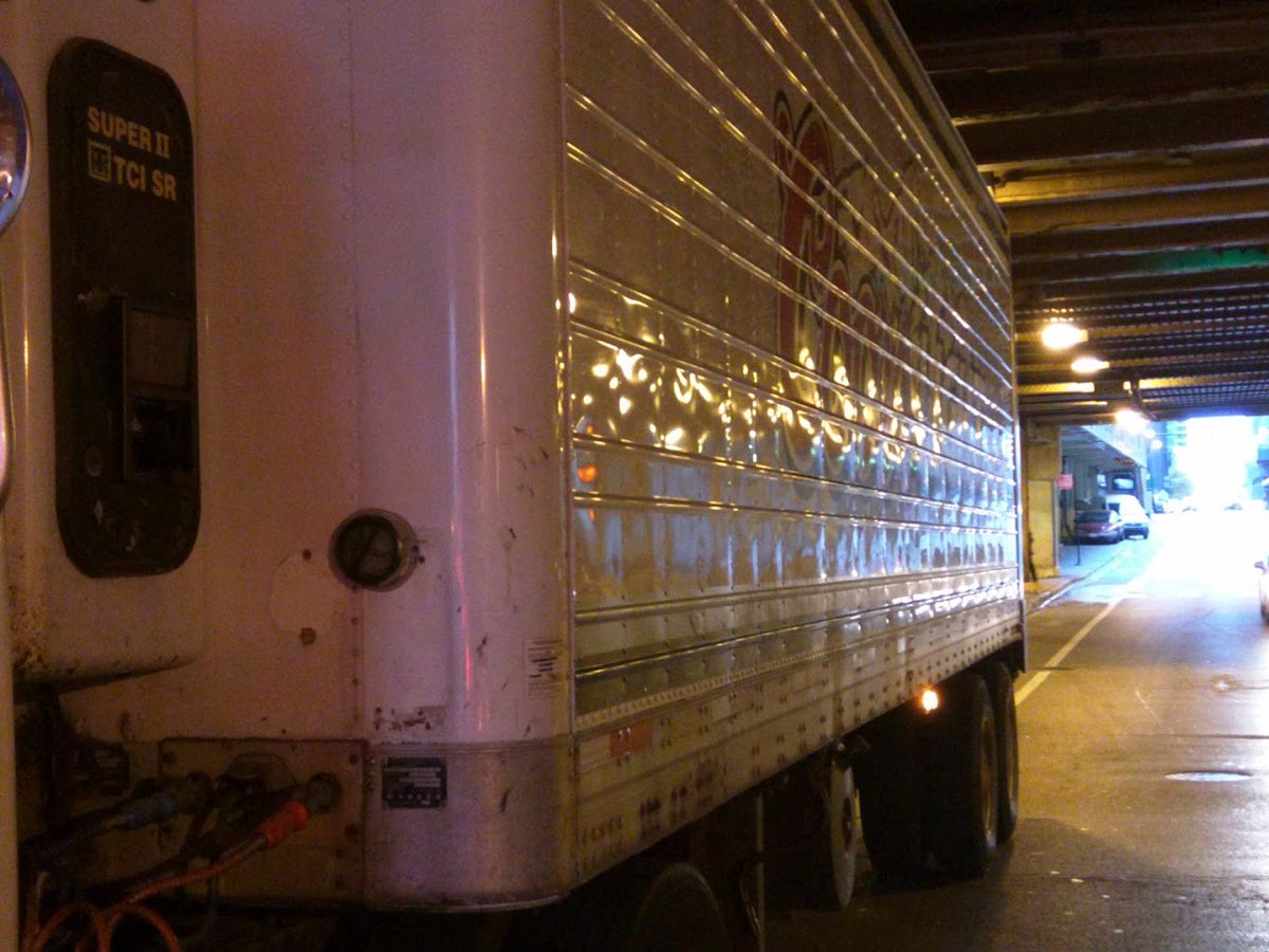 Outtathelane's tweet photo. @ChiBevSystems TTWW)O large semis today in the bike lane on Grand at the most dangerous part under the bridge! @activetrans @thechainlinkorg https://t.co/BKJaCekXvO