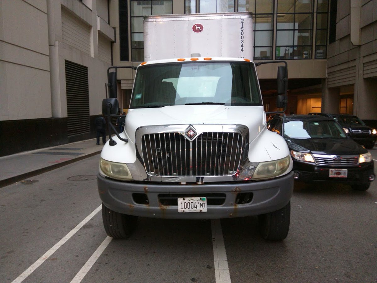 Outtathelane's tweet photo. @ChiBevSystems TTWW)O large semis today in the bike lane on Grand at the most dangerous part under the bridge! @activetrans @thechainlinkorg https://t.co/BKJaCekXvO