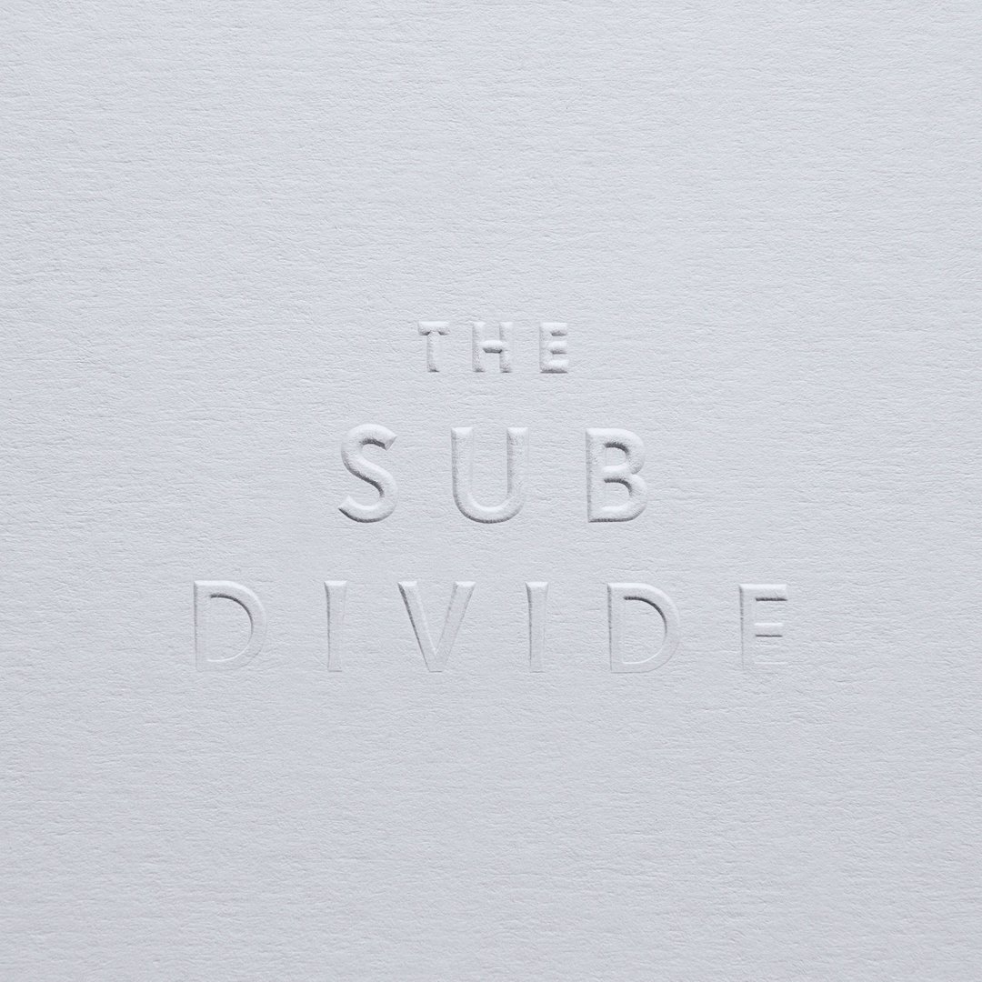 GFSmithpapers's tweet photo. Cover of #TheSubDivide designed @GroszCoLab featuring multi level embossing dissipating to nothing by Avon Graphics on Colorplan Cool Grey. https://t.co/VkIoM4zg2l