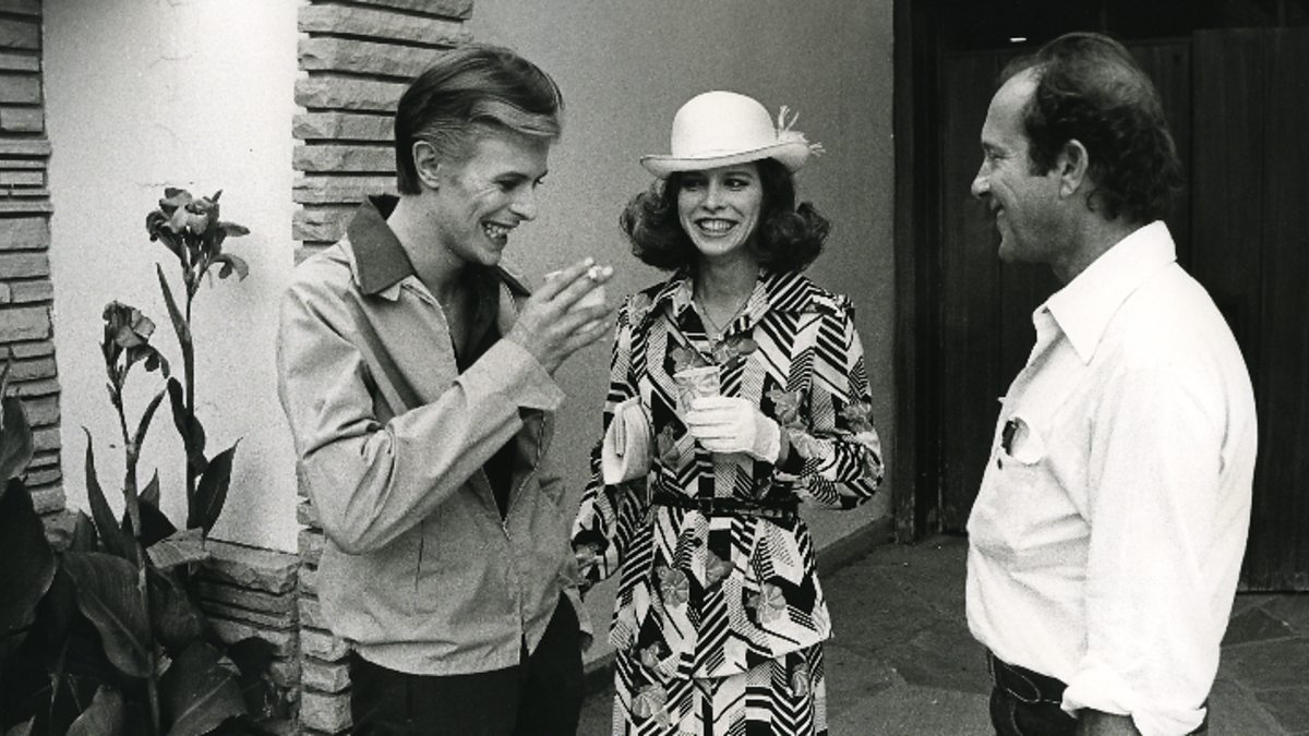 David Bowie and Candy Clark with director Nicolas Roeg on the set of The Man Who Fell To Earth, 1975