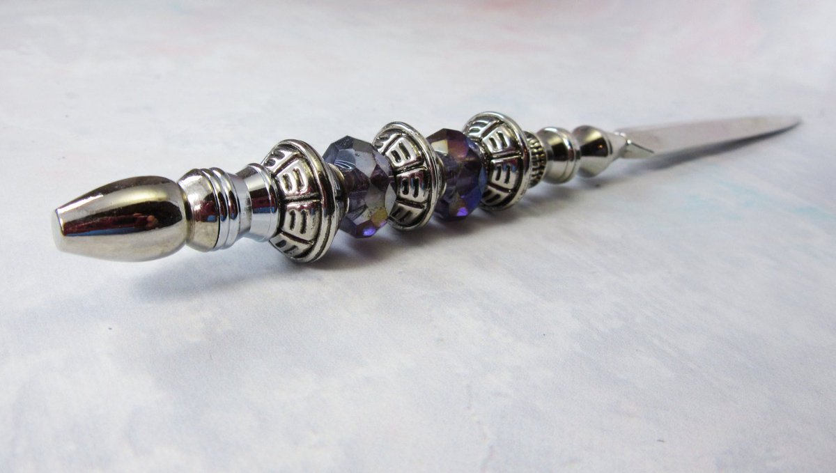 Gwynstone's tweet photo. silver letter opener - purple shimmery - crystal facets - silvertone… https://t.co/dekg8mQvuw #Etsy #OfficeAccessory https://t.co/I19W4x0feQ