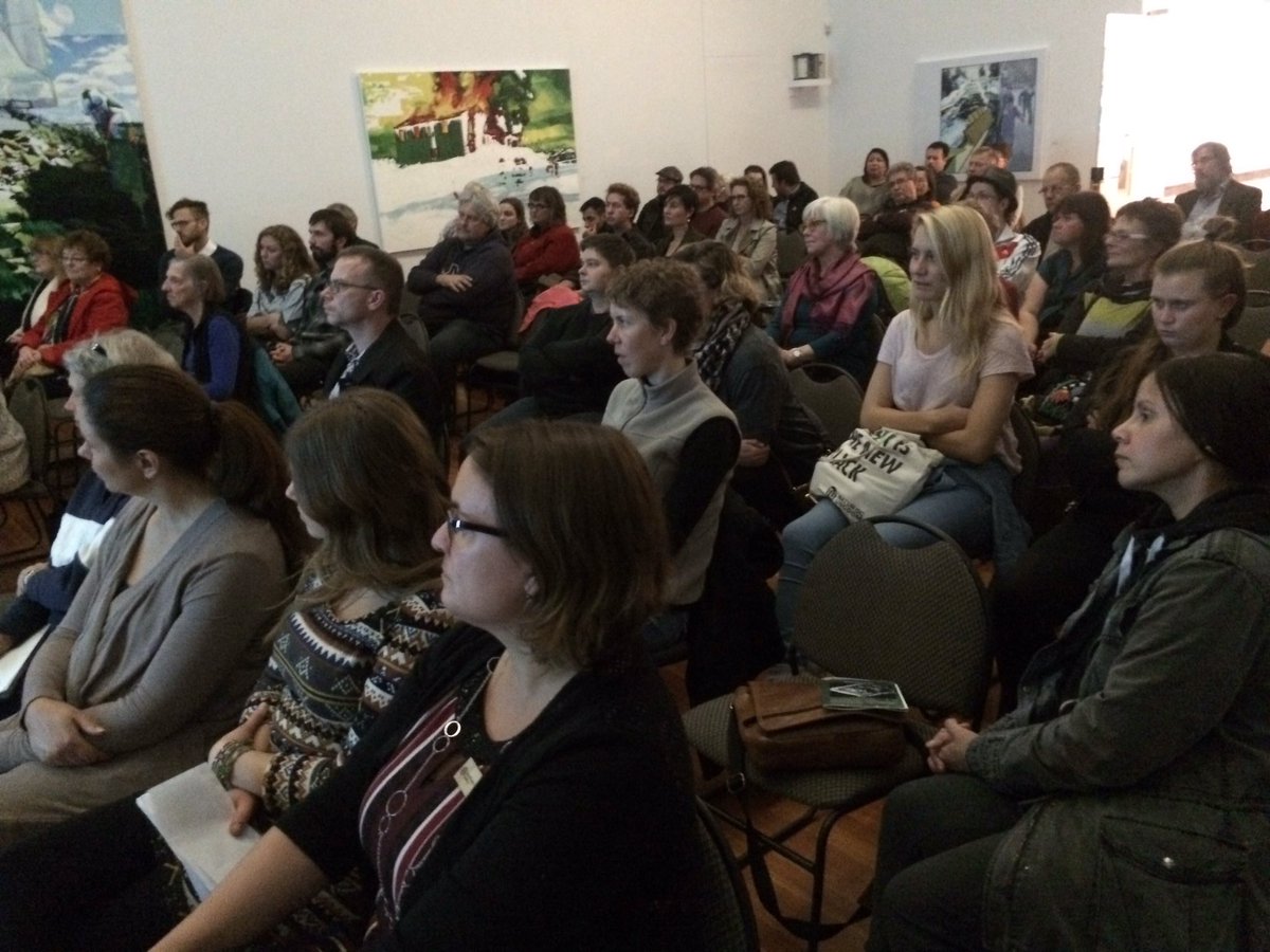 tworiversart's tweet image. A packed house listens intently to artist Allyson Glenn, creator of "Catalyst." #cityofpg #2rg #canadianart