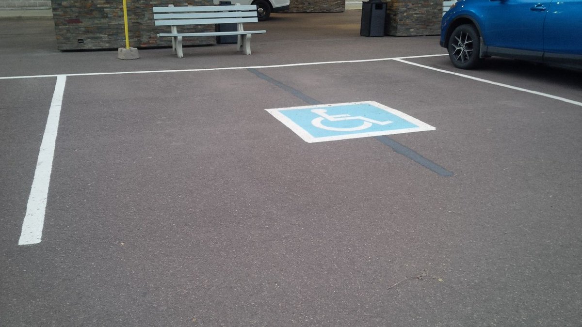 AbilityNB's tweet photo. @FPMoncton knows that accessibility is good for businesses!  This accessible parking spot exceeds the #NB regulation. #AccessibleCanada https://t.co/nPDZkddiM0
