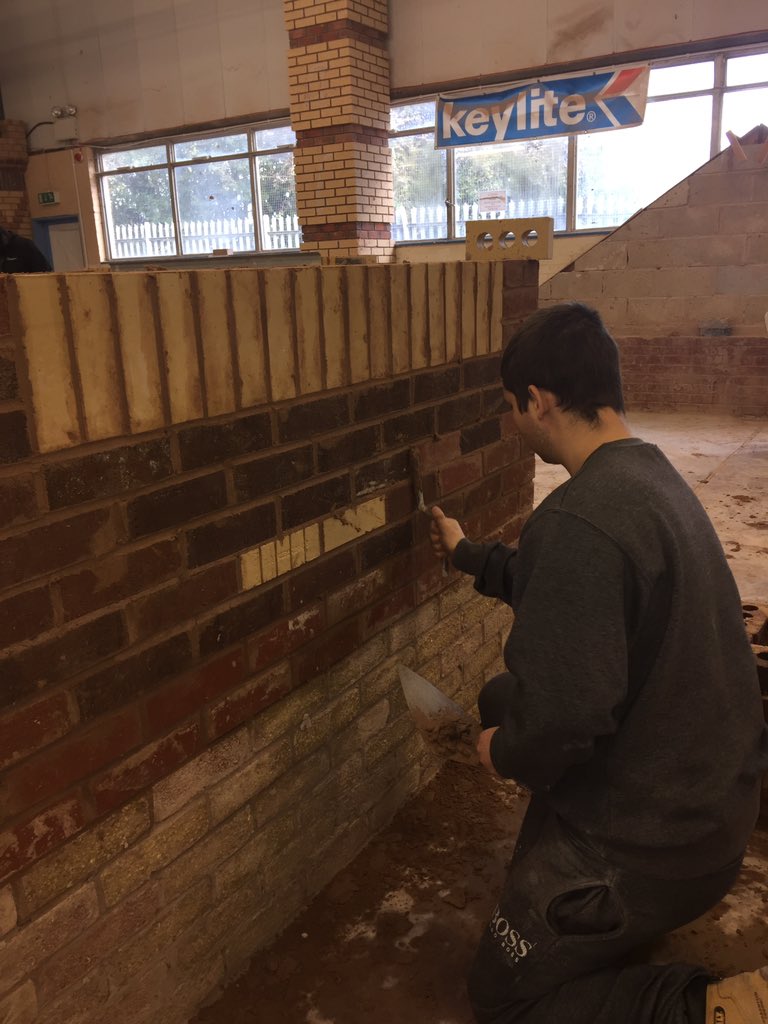 Well done Shaun placing the finishing touch to his wall @colegcambria keep up this excellent work 👍