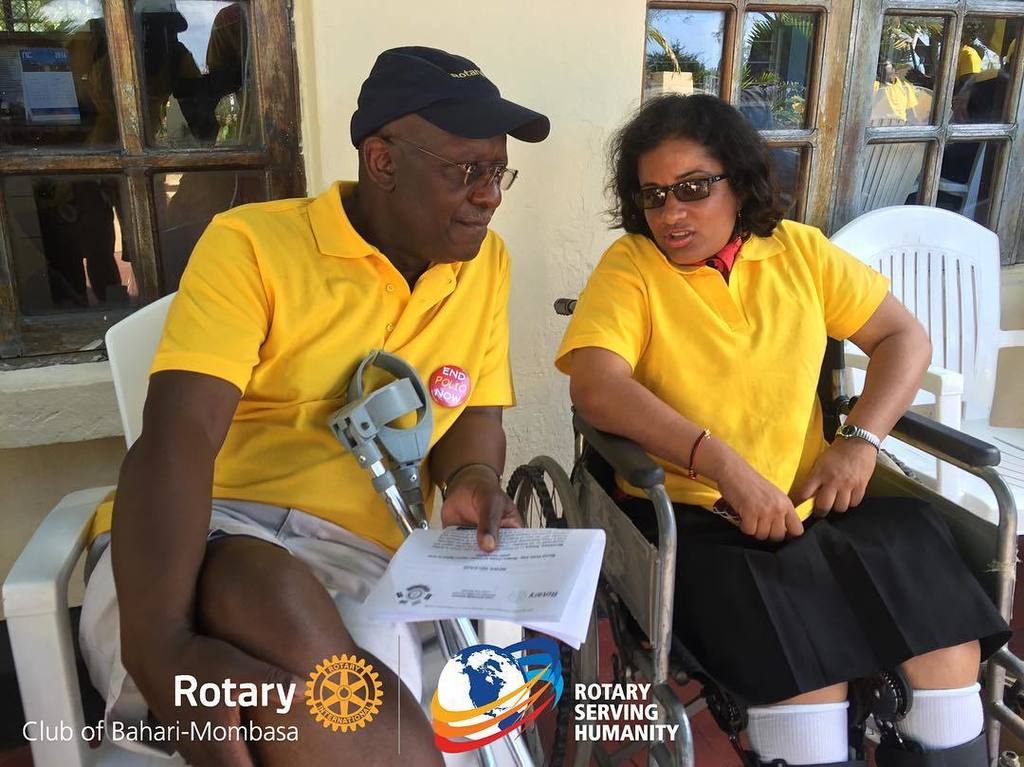 rcbaharimsa's tweet photo. District Governor Richard Omwela catching up with a polio survivor #coastpolioeradicationwalk #rotaryinternational … https://t.co/t28nlxelR3