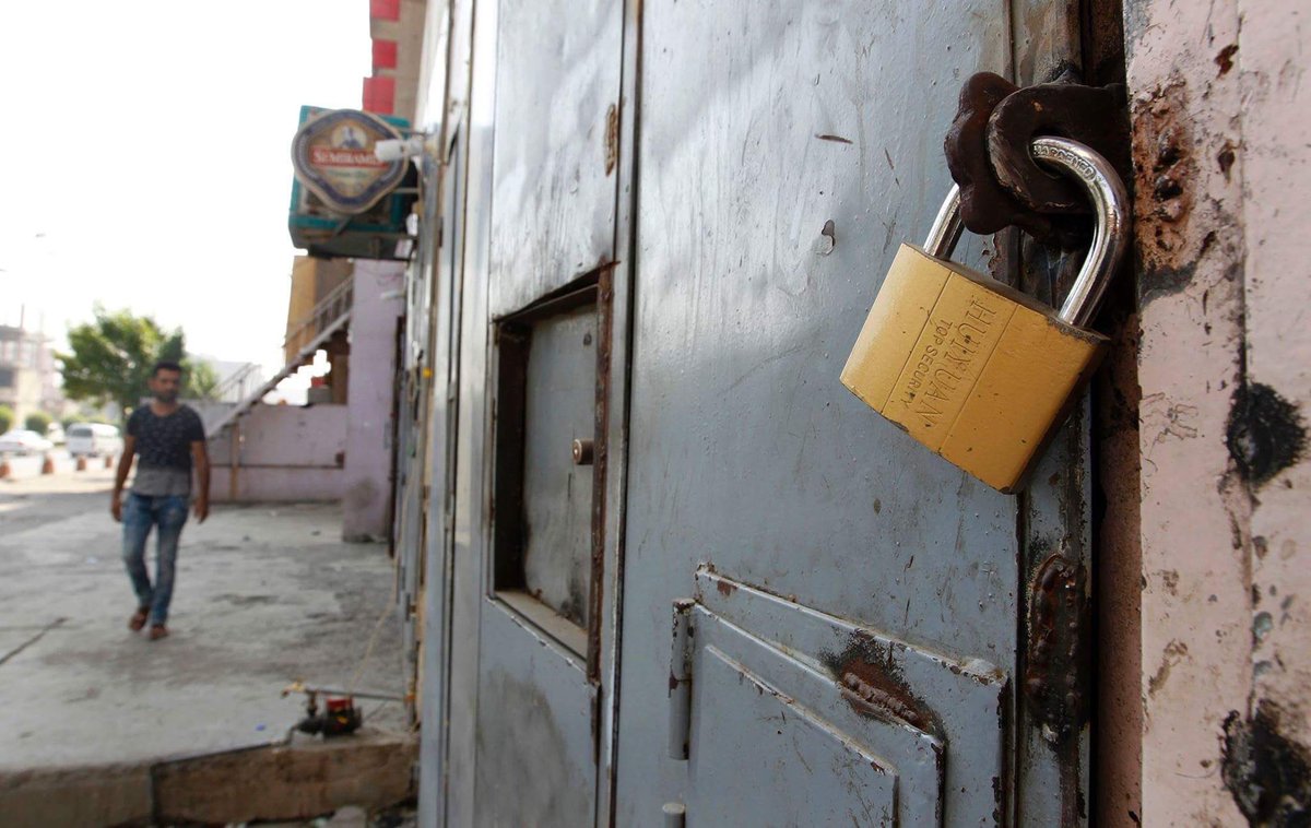 media_zin's tweet photo. Shops selling alcoholic beverages forced to lock up as #Iraqi parliament bans the import, production, and selling of alcohol. https://t.co/sO8so6D6gO