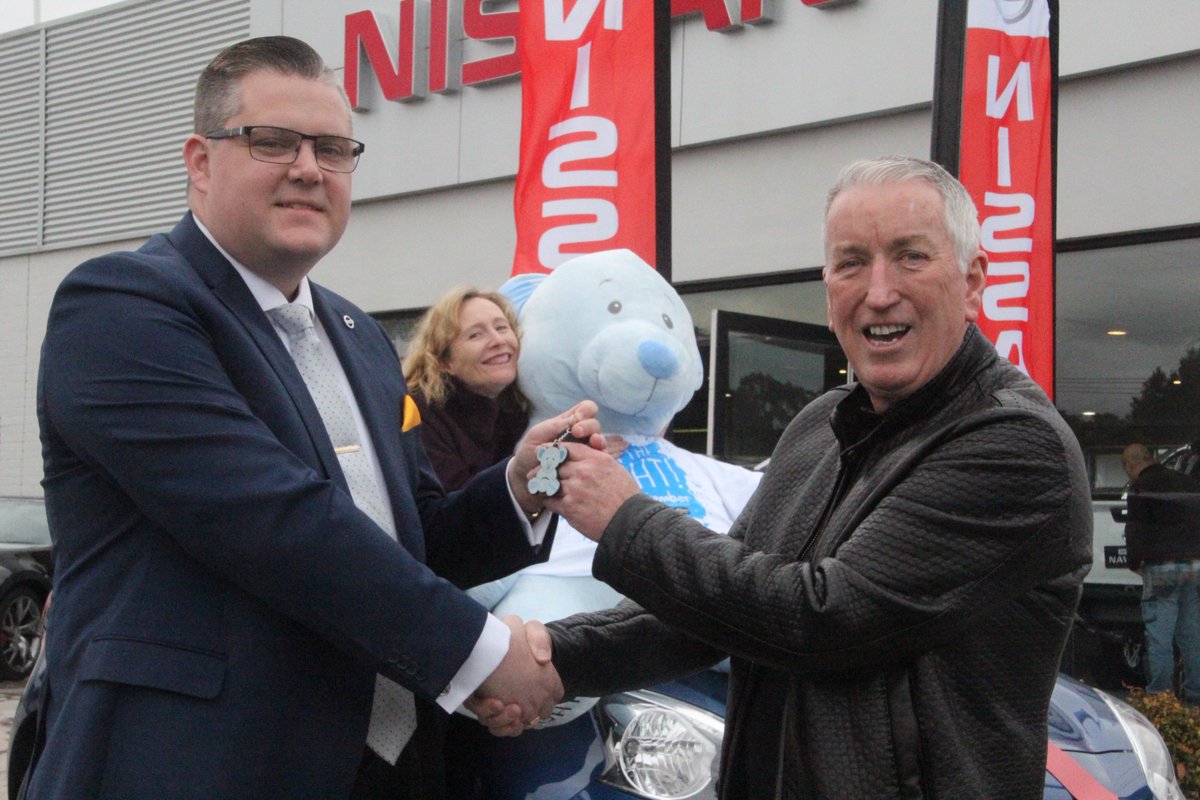 Brighton Nissan's Cameron Semark presents the keys to the winner of the Big Bluey Win a Car raffle - Philip Allen of Reservoir VIC
