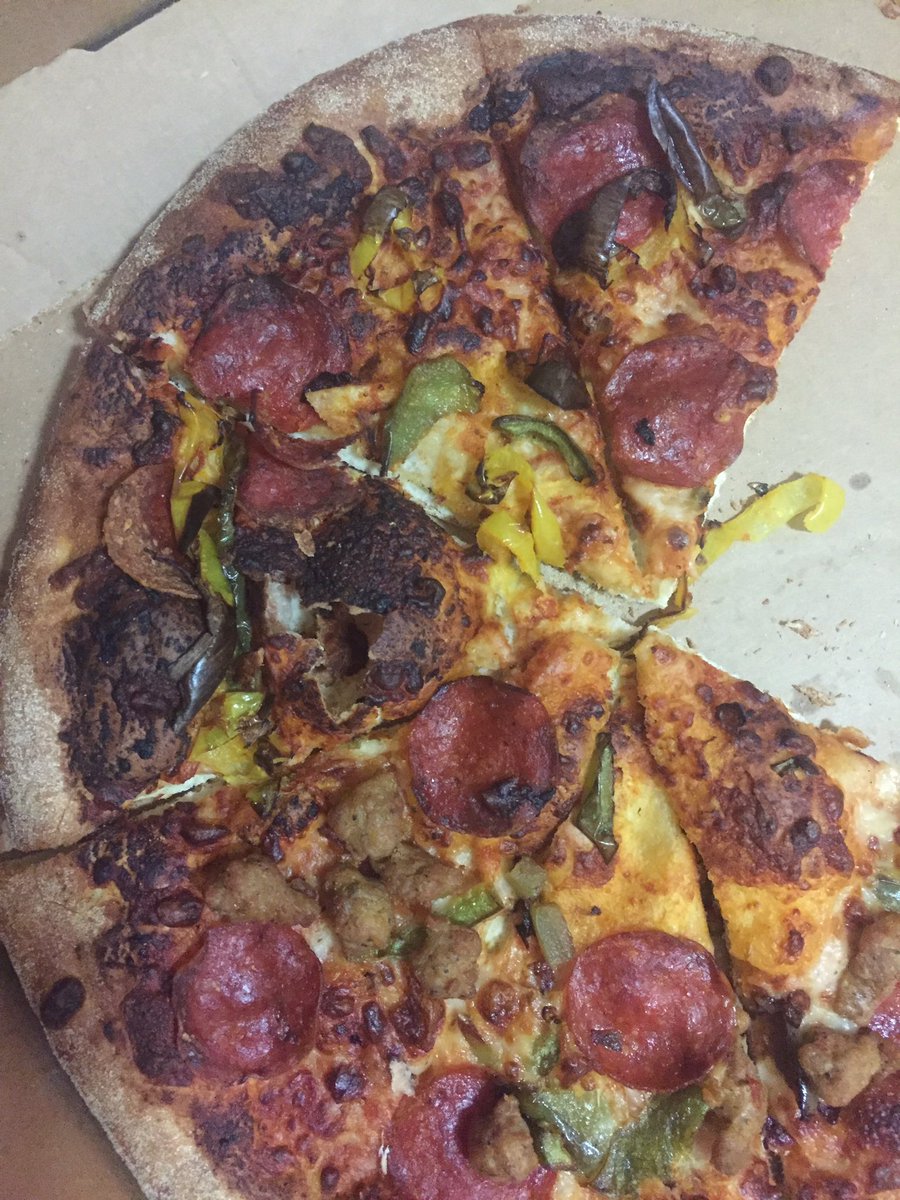AdrisDeBarge's tweet photo. This sad, badly burned, cheeseless, pie arrived to my doorstep. Thx @dominos . Should've had a V-8. https://t.co/3tameE40PG