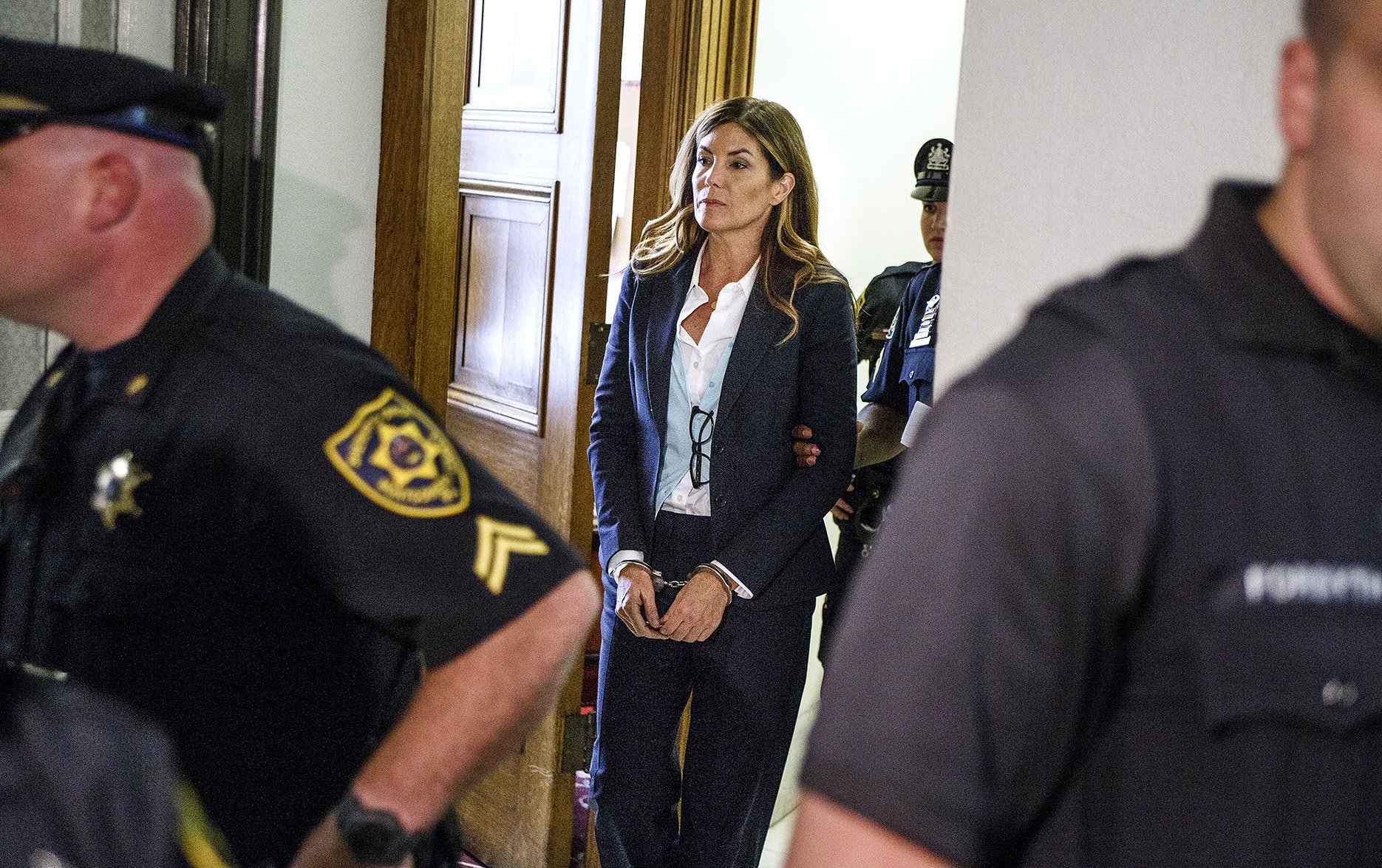 Attorney General Kathleen Kane leaves in handcuffs after her sentencing at ...