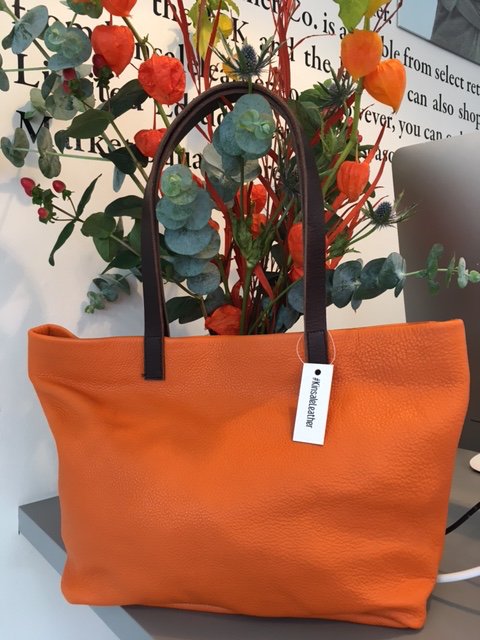 kinsaleleather's tweet photo. Trick or Treat? Definitely treat with this pumpkin orange Baby Alabama exclusive to our #Kinsale store! #Handmade #Leather #Halloween https://t.co/J27li0WXRH