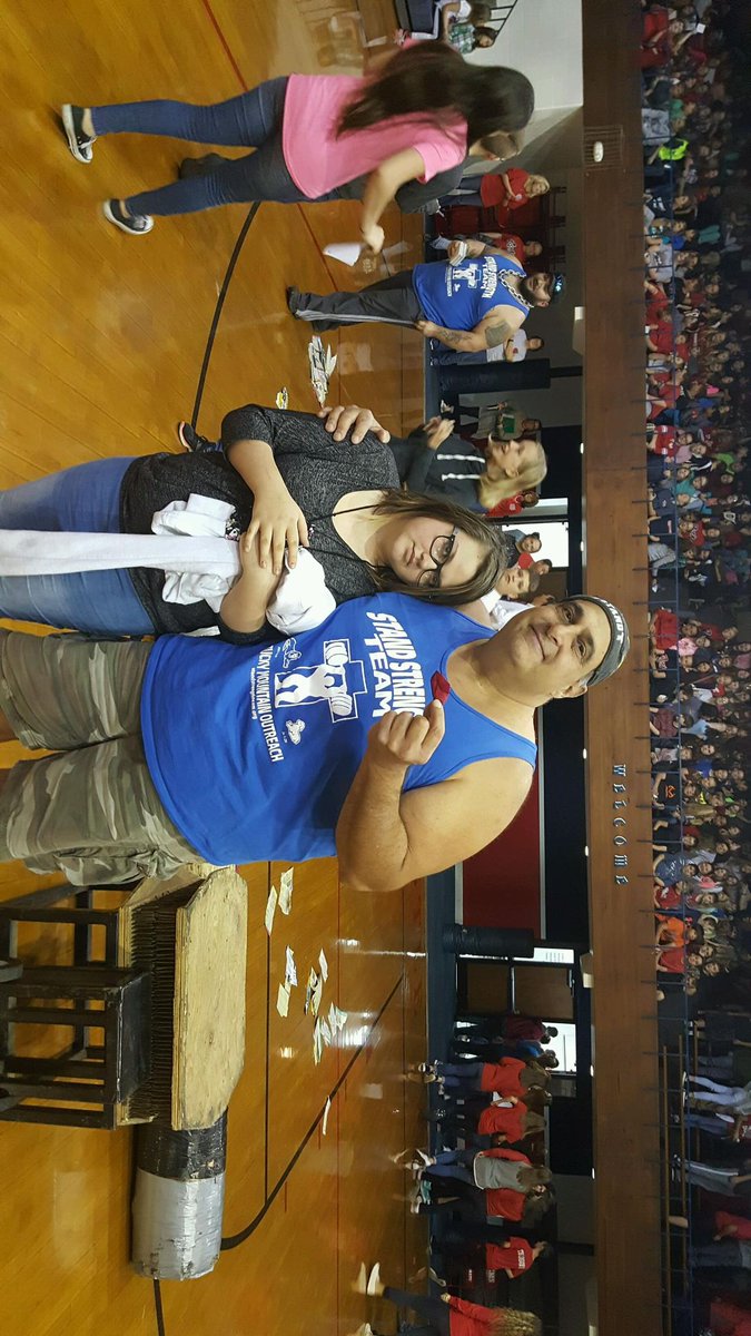 Stand_Strength's tweet image. Shrek taking a picture with a young lady who said the STAND Strength Team changed her life last year.