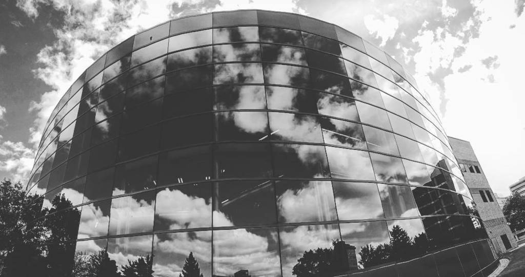BTWeatherston's tweet photo. Loving the clouds and reflections off the library at @umflint. #9to5 https://t.co/x3Mi29GB1T