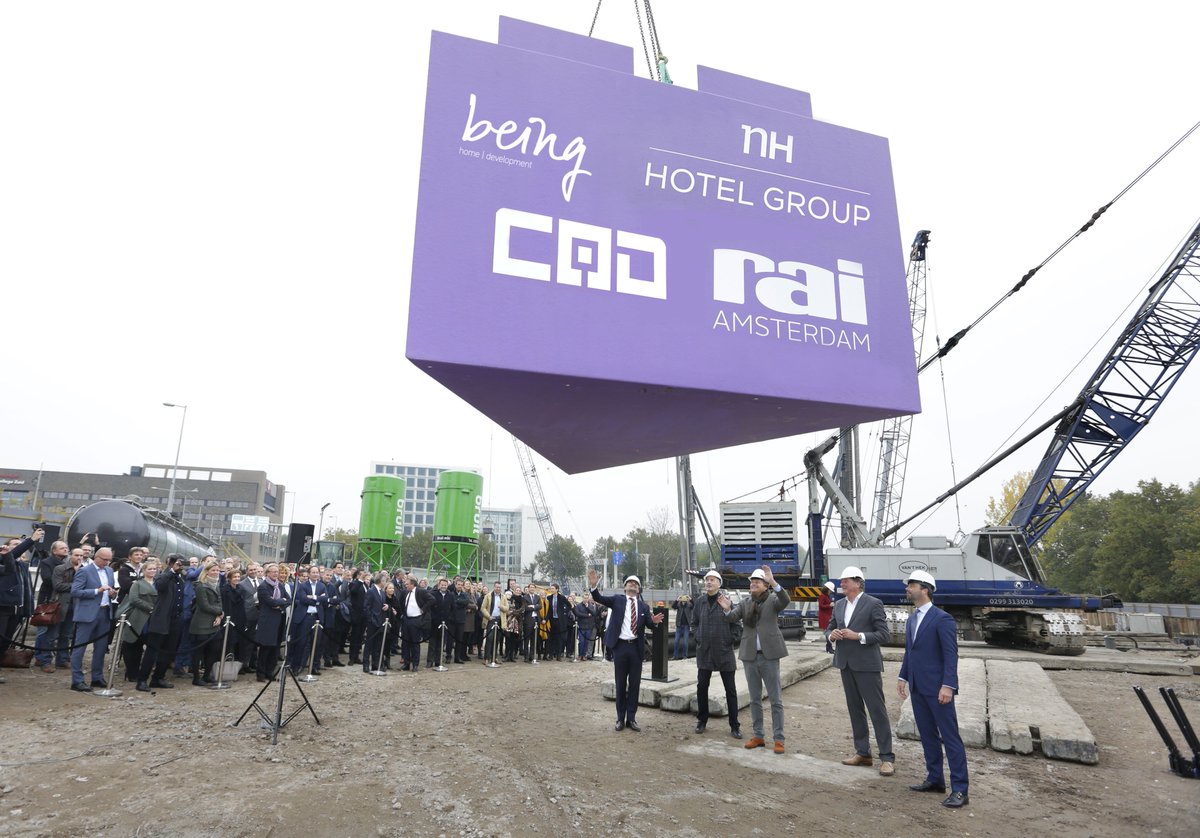 RAI_Amsterdam's tweet photo. Construction of the nhow Amsterdam RAI hotel officially started today with the symbolic placement of a large triangular slab! https://t.co/kcFUWaXKU2