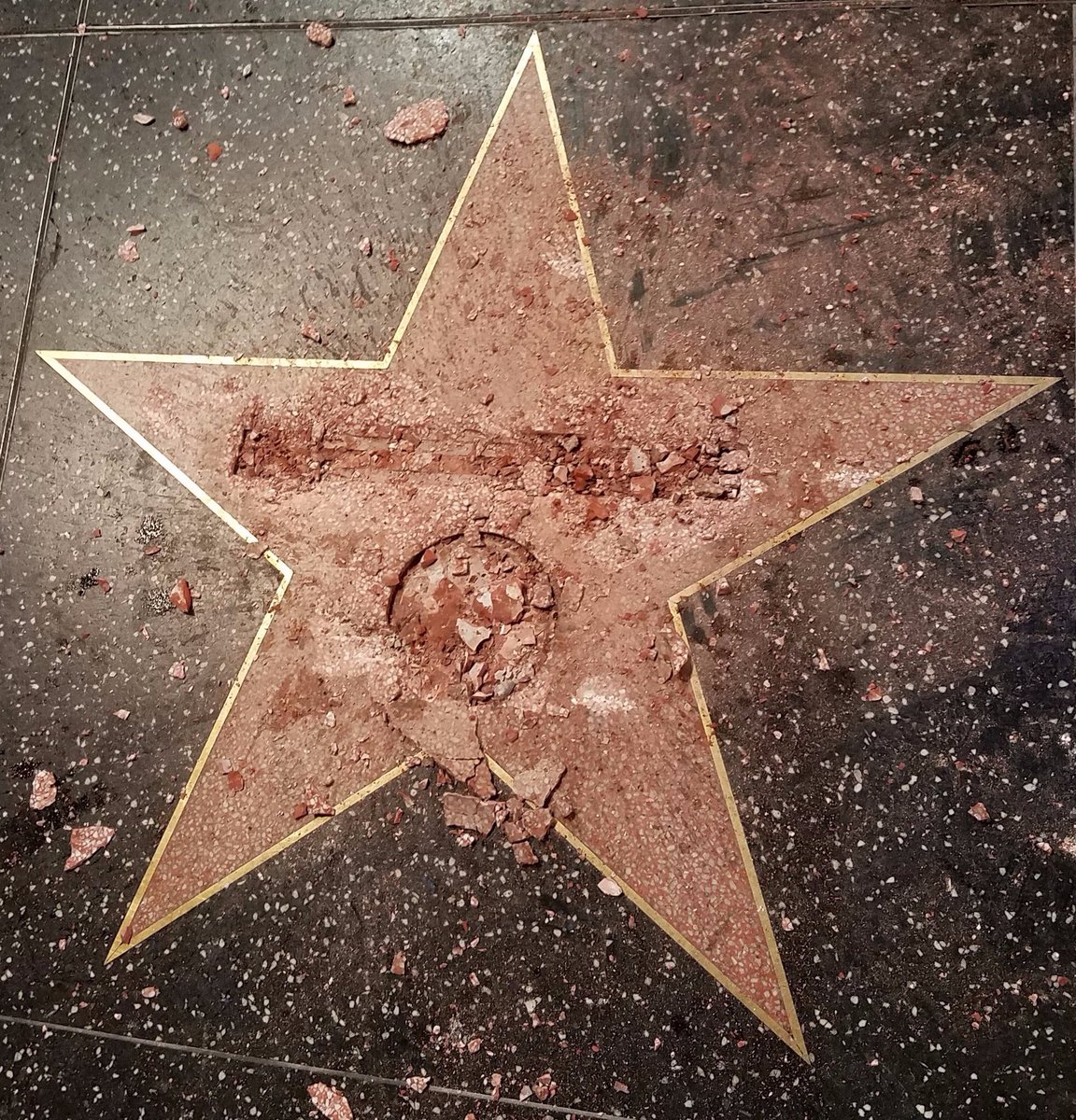 dehumnizing's tweet photo. the man who destroyed donald trump's hollywood walk of fame star said he did it for sexual assault victims. not all heroes wear capes https://t.co/mYUvtdErHe