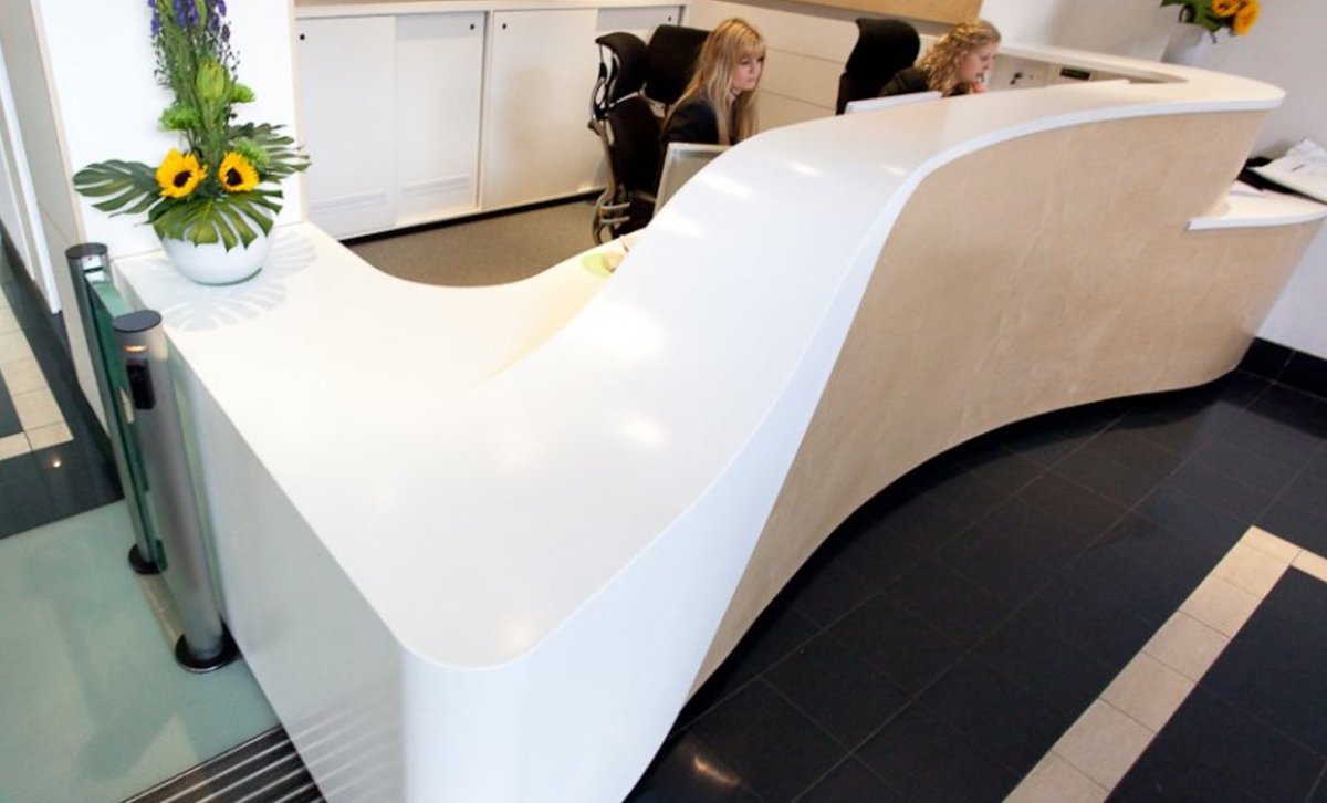Corian® surfaces can be carved into any shape or form - like this reception desk: bit.ly/2esV0zu