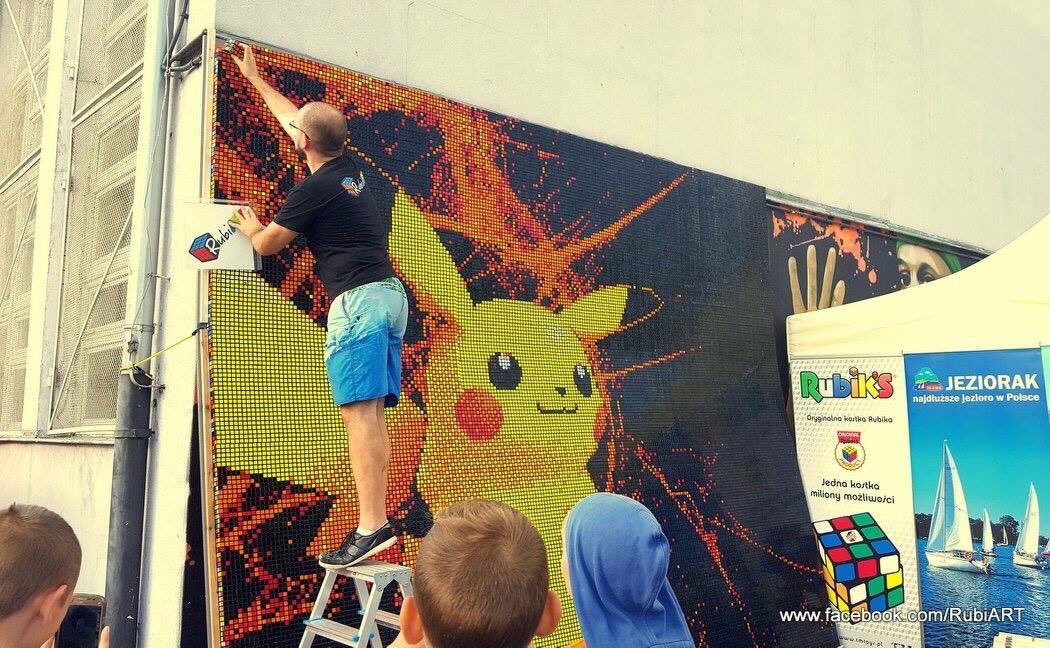 PokeTrends's tweet image. A Pikachu mural made from Rubik's Cube pieces.