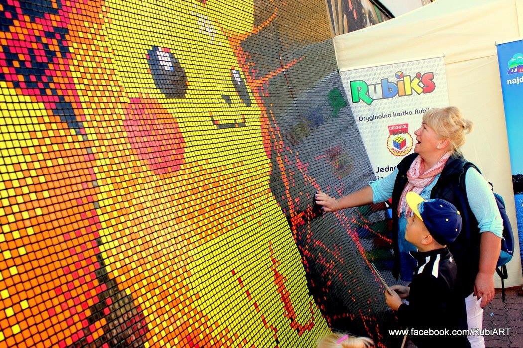 PokeTrends's tweet image. A Pikachu mural made from Rubik's Cube pieces.