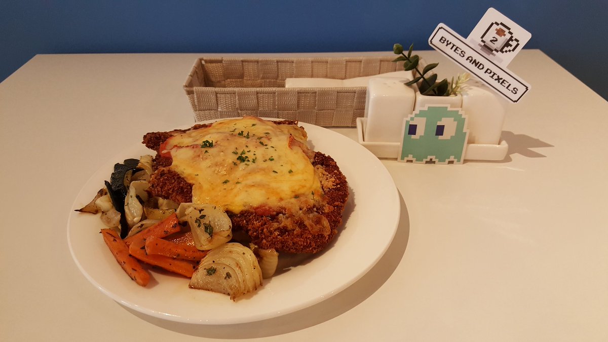 BytesNPixelsMY's tweet photo. Presenting, the Chicken Parmigiana from our Special Menu! That ghost seems to be interested. #cafe #BytesAndPixels #sunway https://t.co/j6lvTwUxD5