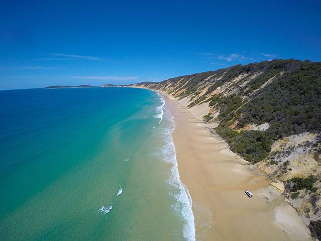 Coloured sands, clear 🌊 & 💙 skies, there's no highway like #RainbowBeach! Pic: @360drone_sunshinecoast/IG #VisitSunshineCoast @Queensland
