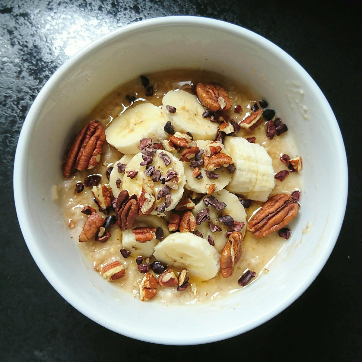 lucybeecoconut's tweet photo. Oats for breakfast with almond milk, Lucy Bee Lucuma Power, banana 🍌, walnuts, cacao nibs and honey 🍯 https://t.co/UjfC0rDnJa